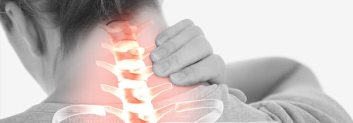 Woman-Holding-Her-Neck Woman Holding Her Neck in Pain